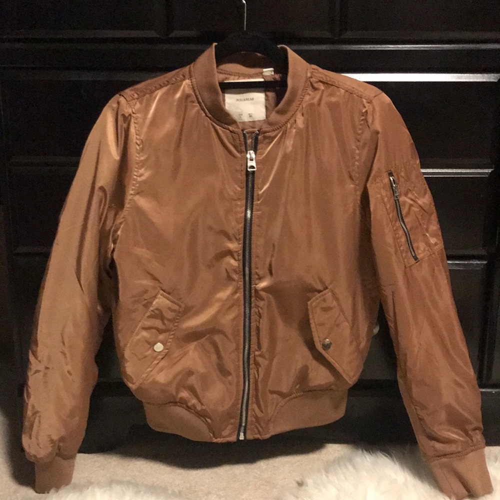 Satin-like bomber style jacket with cinch detail.